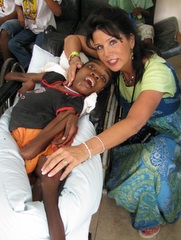 Patricia with a child in need. Patricia with a child in need.